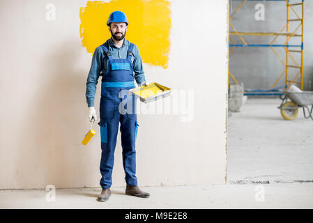 Painter at the construction site Stock Photo