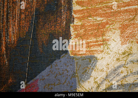 Fragment of retro colorful tapestry textile with vintage ornament useful as background Stock Photo