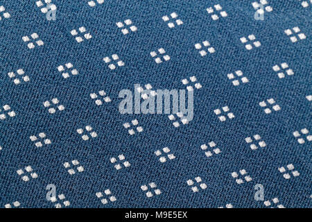 Dotted embroidery on canvas. Handmade woven cotton fabric Stock Photo