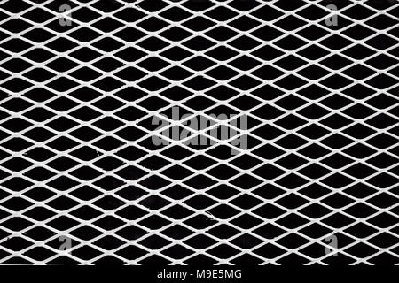 Diagonal white metal wire grid or mesh, black background. Black and white image Stock Photo