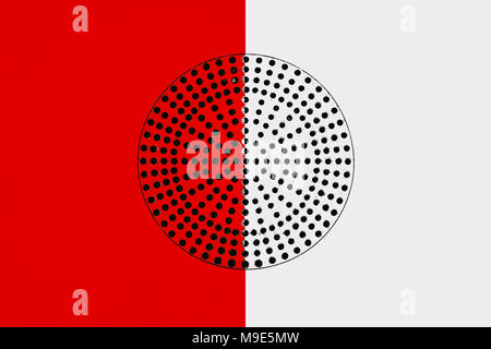 Metal surface painted in red and white. Black circle with a lot of small perforated holes in the middle. Industrial pattern Stock Photo