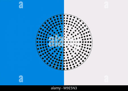 Metal surface painted in blue and white. Black circle with a lot of small perforated holes in the middle. Industrial pattern Stock Photo