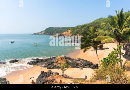 Paradise beach in Gokarna, India. Beautiful deserted landscape with clean sand and wave. View from the sea to the shore. Stock Photo