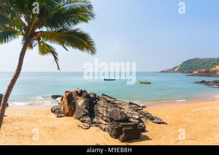 Paradise beach in Gokarna, India. Beautiful deserted landscape with clean sand and wave. View from the sea to the shore. Stock Photo