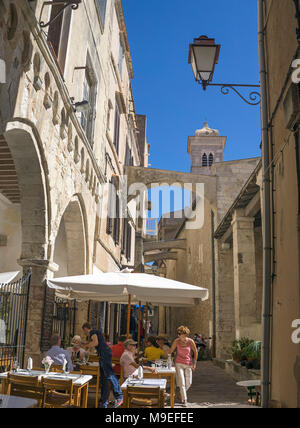 Idyllic restaurant at old town, behind the church Eglise Sainte Marie Majeure, Bonifacio, Corsica, France, Mediterranean, Europe Stock Photo