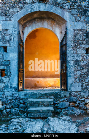 Sunlight shining through the gate in old building Stock Photo