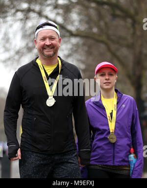 Runners pose with their finisher medals after the 2018 London Landmarks Half Marathon. PRESS ASSOCIATION Photo. Picture date: Sunday March 25, 2018. Photo credit should read: Steven Paston/PA Wire Stock Photo