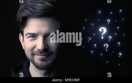 businessman with many question mark near him Stock Photo