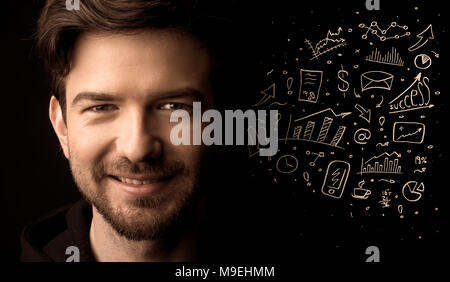 A successful confident businessman near graph pie charts and calculations concept Stock Photo