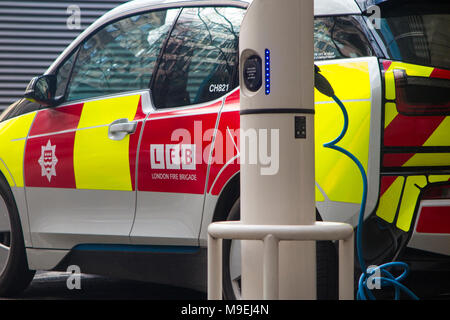 A London Fire Brigade smart BMW i3 car being charged outside the firestation Stock Photo