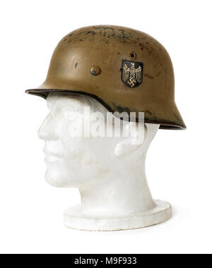 German Third Reich WW2 steel helmet (M42 Stahlhelm) from 1942 with German Eagle decals. The decals were removed in 1943 to speed up production. Stock Photo