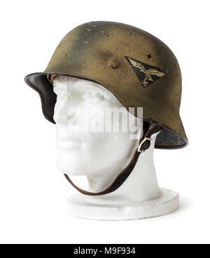German Third Reich WW2 steel helmet (M42 Stahlhelm) from 1942 with Swastika / Luftwaffe decals. The decals were removed in 1943 to speed up production. Stock Photo