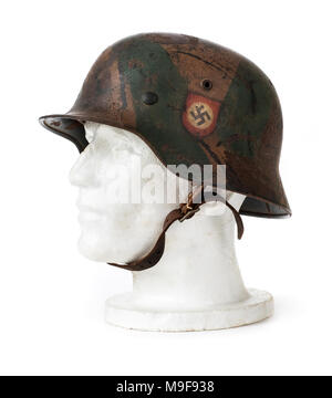 WW2 German Third Reich 'SS' steel helmet (M40 Stahlhelm) from 1940 with original Swastika and SS decals, made by Eisen und Huttenwerke A.G, Thale. Stock Photo