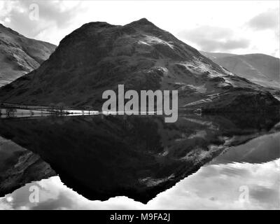 Rannerdale Knotts reflected in Crummock Water, Lake District National Park, Cumbria, United Kingdom Stock Photo