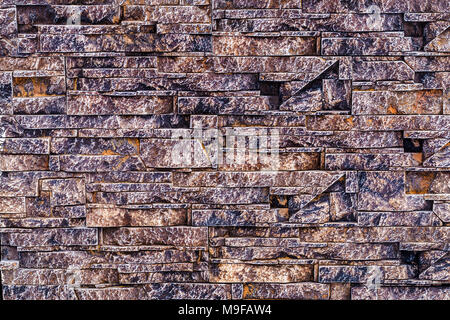 a pattern collected from a variety of decorative, multi-colored stones, background photo, close-up Stock Photo