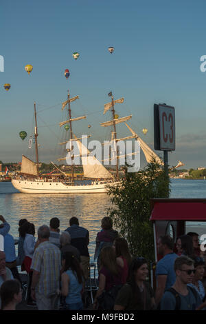 Balloons crossing the Kiel Fjord during 'Kiel Week' or 'Kieler Woche', the worldwide biggest sailing event, Kiel, Schleswig-Holstein, Germany Stock Photo