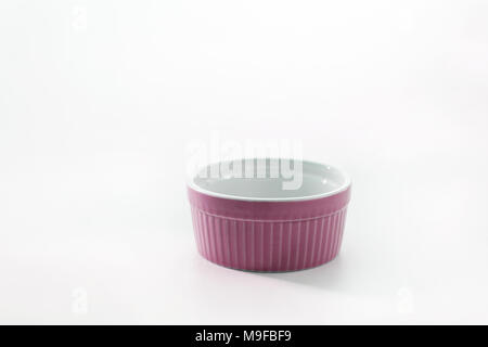 Porcelain souffle ramekin dish isolated on white background. Stock Photo