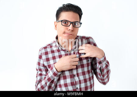 Portrait of person in eyeglasses is disabled, invalid. Funny emotions and feelings. Indoor shot, gray background Stock Photo