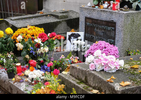 Paris, France - September 2017: Jim Morrison grave in Pere-Lachaise cemetery, Paris. Each year thousands fans and curious visitors come to pay homage  Stock Photo