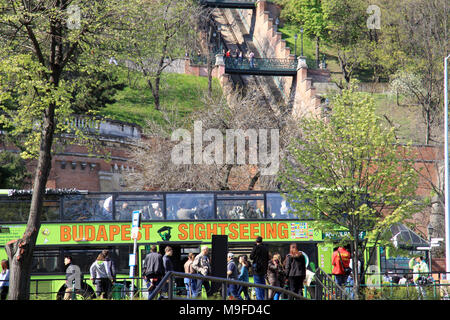Budapest Sightseeing bus full of tourists in front of the funicular railway in the Hungarian capital city of Budapest Hungary Stock Photo