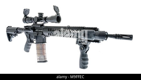 An AR -15 with a scope and flashlight on an isolated background. Stock Photo