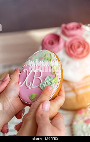 Easter egg gingerbread in the Russian tradition, in the hands of the child Stock Photo