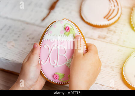 Easter egg gingerbread in the Russian tradition, in the hands of the child Stock Photo