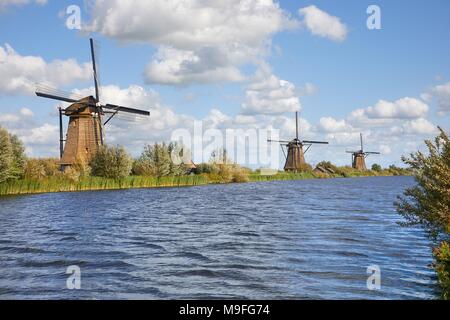 Windmill beside a canal Stock Photo