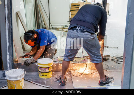 Buenos Aires Argentina,remodeling,under new construction site building builder,adult adults man men male,worker,welding,face mask,work safety,job,visi Stock Photo
