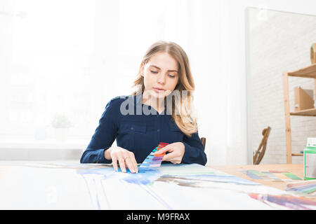 Designer with samples Stock Photo