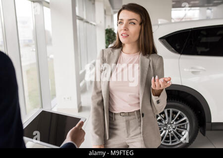 Businesswoman Choosing New Car Stock Photo