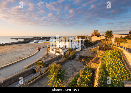 Lyme Regis, Dorset, UK. 26th March 2018. UK Weather.  View from the Jane Austen Gardens looking towards the Cobb Harbour at sunrise at the seaside resort of Lyme Regis in Dorset. Picture Credit: Graham Hunt/Alamy Live News. Stock Photo