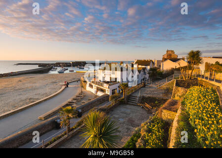 Lyme Regis, Dorset, UK. 26th March 2018. UK Weather.  View from the Jane Austen Gardens looking towards the Cobb Harbour at sunrise at the seaside resort of Lyme Regis in Dorset. Picture Credit: Graham Hunt/Alamy Live News. Stock Photo