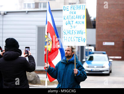 26 March 2018, Germany, Neumuenster: A demonstrator standing in front of the correctional facility where the former catalonian Regional President Puigdemont was brought after his arrest on Sunday (25 March). Photo: Frank Molter/dpa Stock Photo
