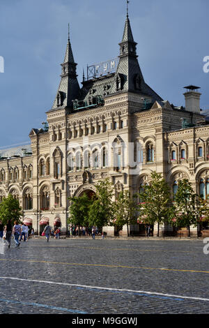 Moscow, Russia - July 2, 2014: People on the Red Square in front of GUM. The building erected by design of A. N. Pomerantsev was opened in 1893 Stock Photo