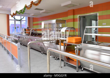 Novosibirsk, Russia - January 15, 2015: Staff preparing to dinner in the student canteen of Novosibirsk State University of Economics and Management.  Stock Photo
