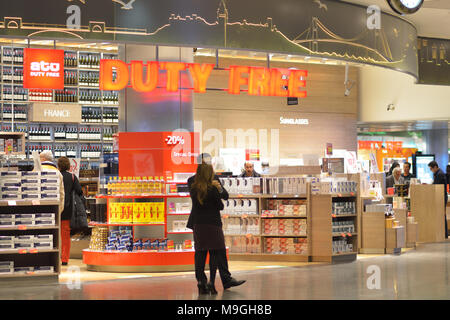 istanbul airport duty free tobacco Istanbul, Turkey - March 12, 2014: People selecting alcohol and cigarettes  in the duty free shop in Ataturk International airport. Alcohol and tobacco  Stock Photo