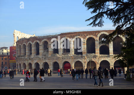 Verona, Italy - January 1, 2013: People walking at Verona Arena, a Roman amphitheater in Verona built in the first century. It is still in use today a Stock Photo