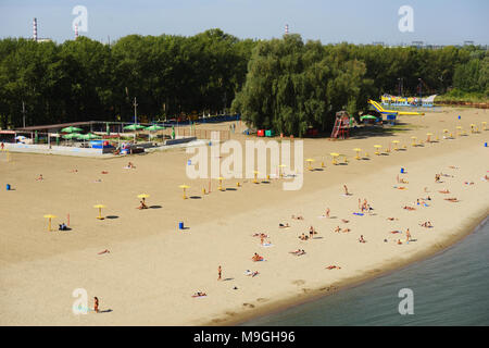 Novosibirsk, Russia - August 24, 2014: People resting on the beach Nautilus on the left bank of Ob river. It is the main city beach of Siberia's capit Stock Photo