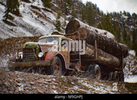 A 1943 International K-10 semi tractor trailer log truck, in an old quarry, east of Clark Fork Idaho. Stock Photo