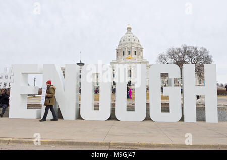 St. Paul, MN, USA – MARCH 24, 2018: Protester holds sign on State Capitol mall moments before students’ arrival during March For Our Lives rally. Stock Photo