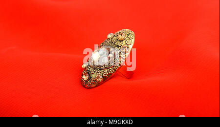 picture of a Fashion ring. Red background, Stock Photo