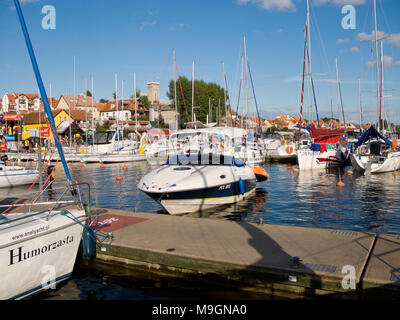 Marina on Mikolajskie lake. Townscape of Mikolajki in the background. Masurian Lakes District. Warmian-Masurian province, Poland. Europe. Stock Photo