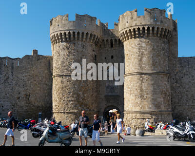 RHODES CITY, GREECE - SEPTEMBER 30, 2011:  Tourists admite Towers of Marine Gate of Old Town, ancient fort of  Rhodes Island Stock Photo