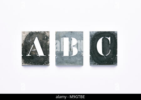 Metal letter stencil A, B, C on  white background Stock Photo