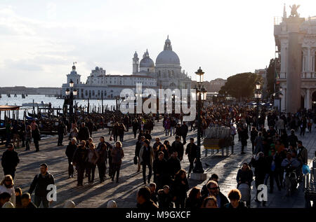 Tourists pack the waterfront of Venice, Italy near St. Marks square. Stock Photo