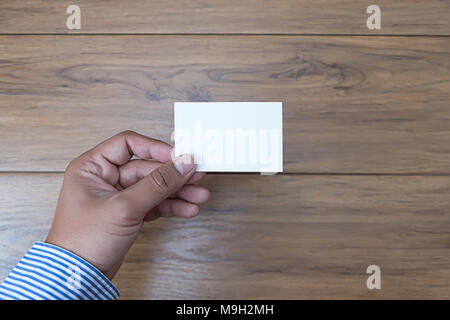Hand hold blank white card mockup Business branding. Stock Photo
