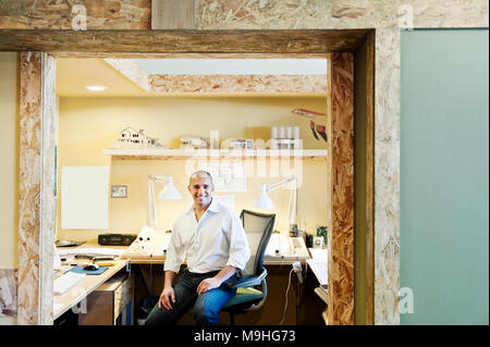 Portrait of a male Hispanic American architect in his office. Stock Photo