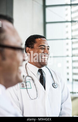 Black man doctor in lab coat with a stethescope. Stock Photo