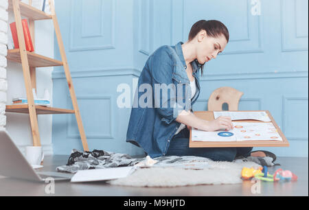 Hard working responsible woman being focused on work Stock Photo